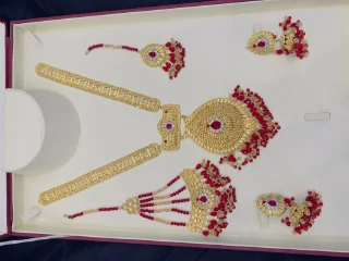 Beautiful gold polish mala set with tikka and jhumar inreal goldlook view 1